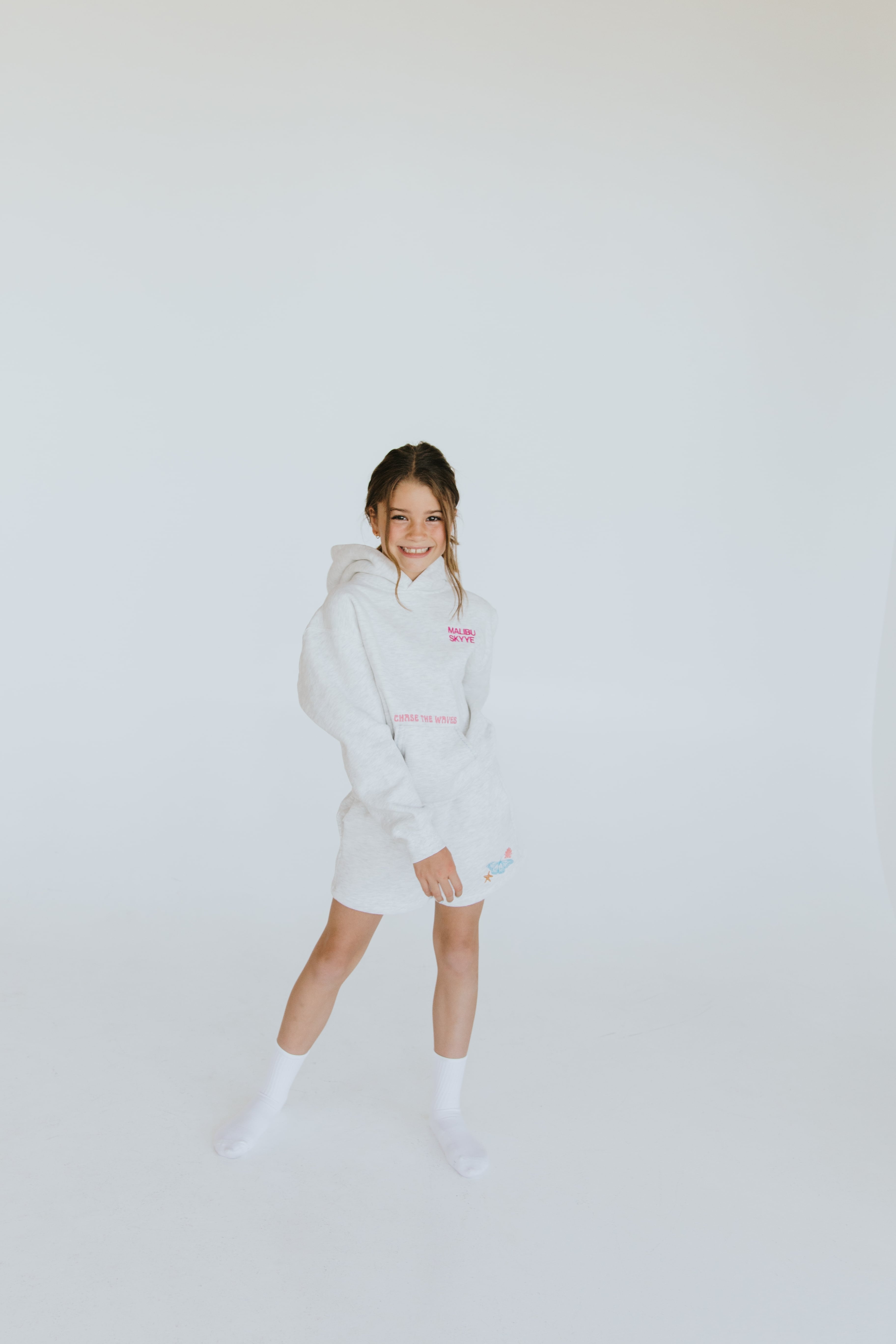 Young model wearing a Malibu Skyye hoodie.